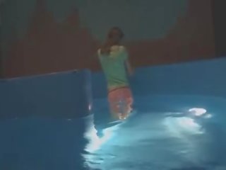 Thin young woman mastrubating in pool